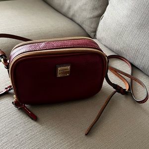 Red leather Dooney & Burke 1975 shoulder bag.  In good condition